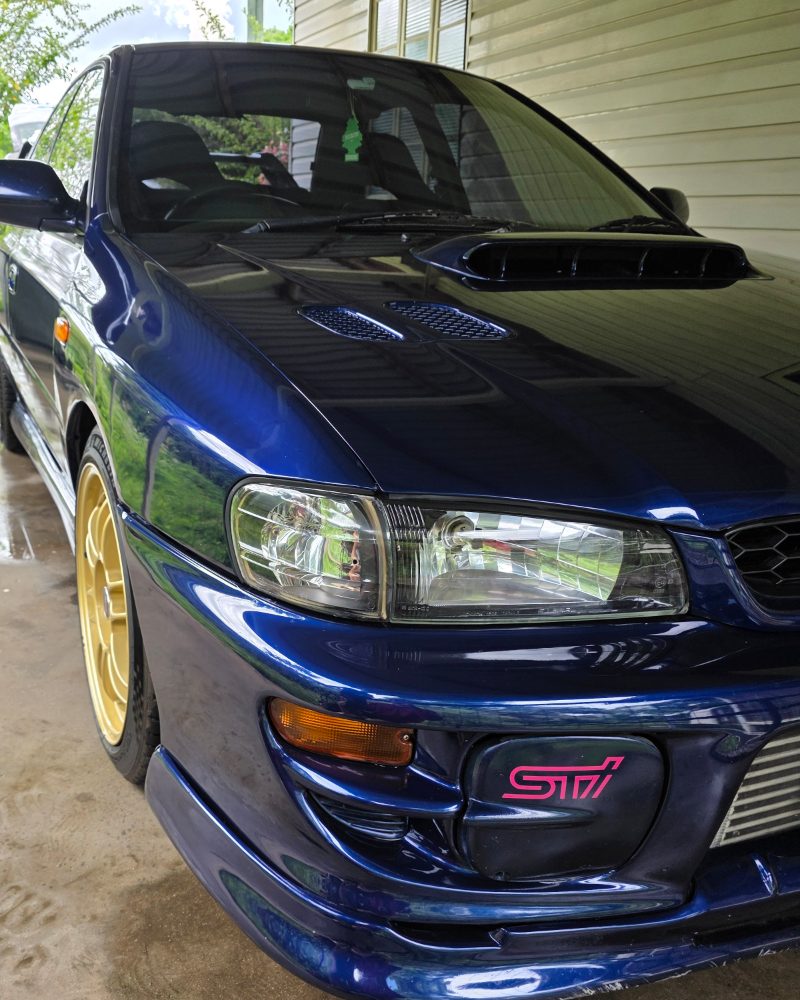Blue Subaru Impreza STI, bonnet and front guard after polishing.